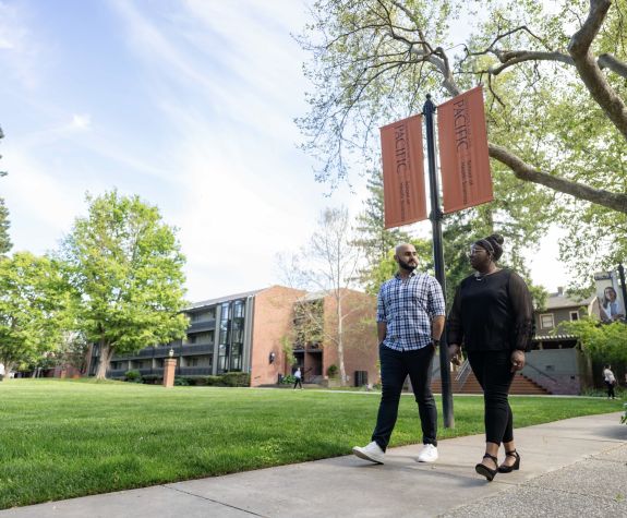 two students walk on the Sacramento Campus
