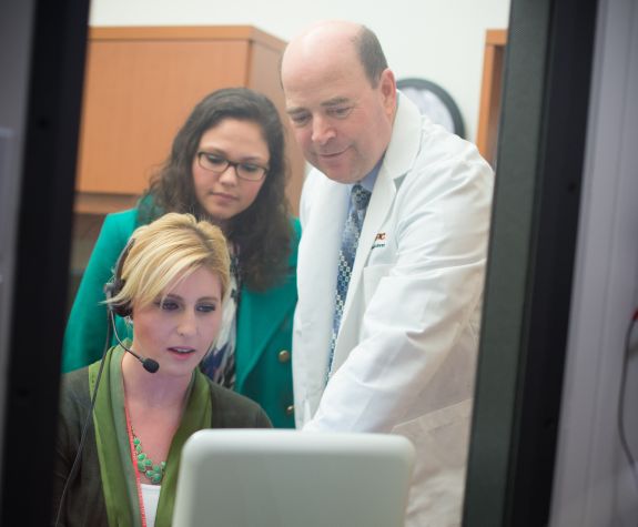 Robert Hanyak and students in an audiology lab