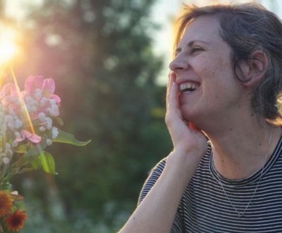 A close up picture of a woman outdoors