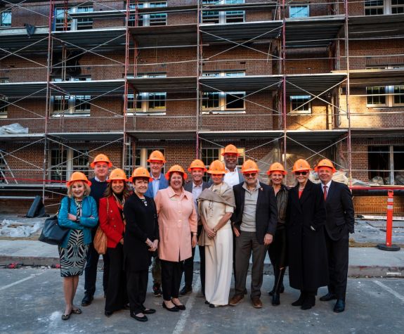 regents wearing hard hats touring southwest hall