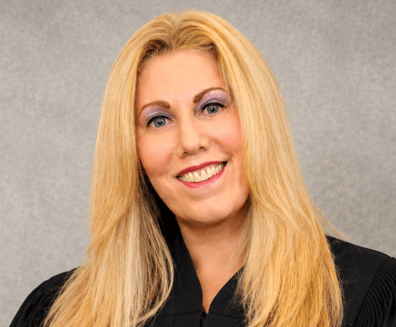 A portrait of a blonde judge