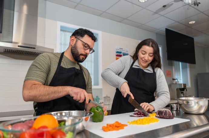 students chop vegetables