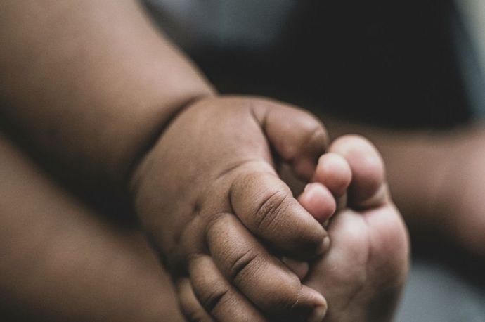 a baby's hand and foot
