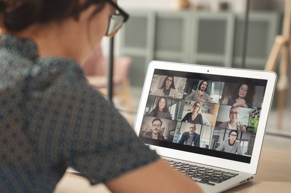 Young woman using computer for video call stock photo