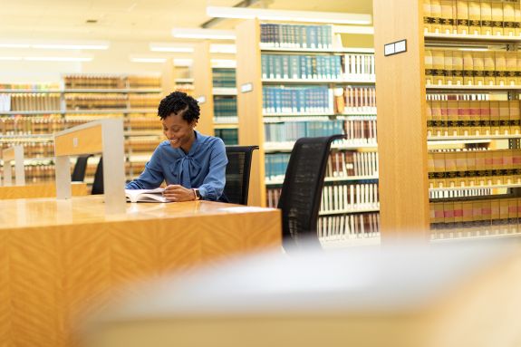 A student studies in a library