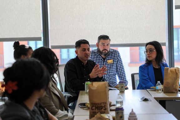 Student discussing intently.