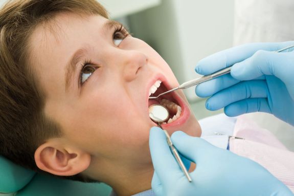 child in dental chair 