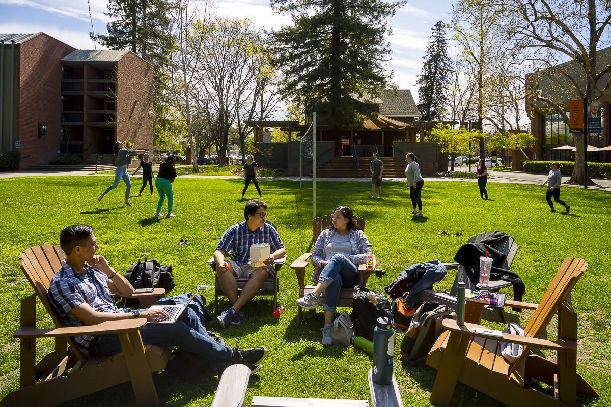 students in the quad with volleyball