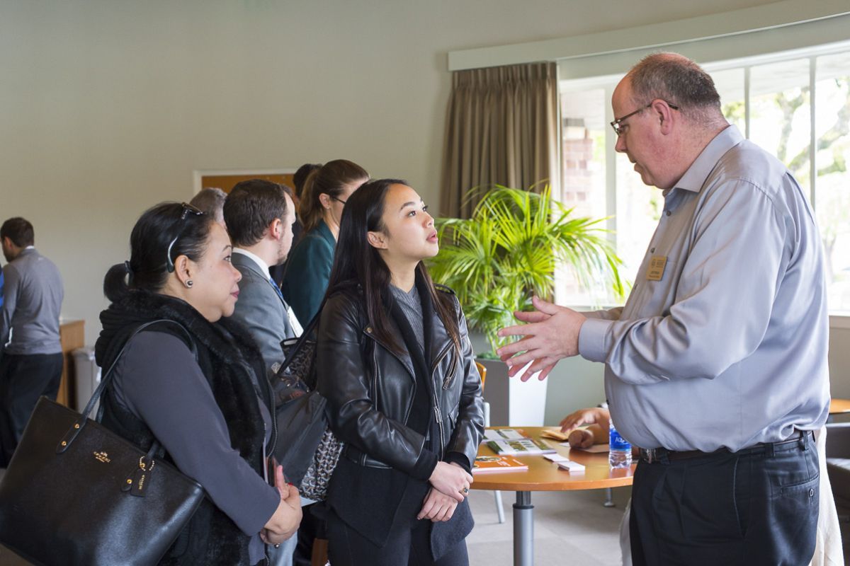 Prospective students meet with Financial Aid Director Joe Pinkas on the Sacramento campus.
