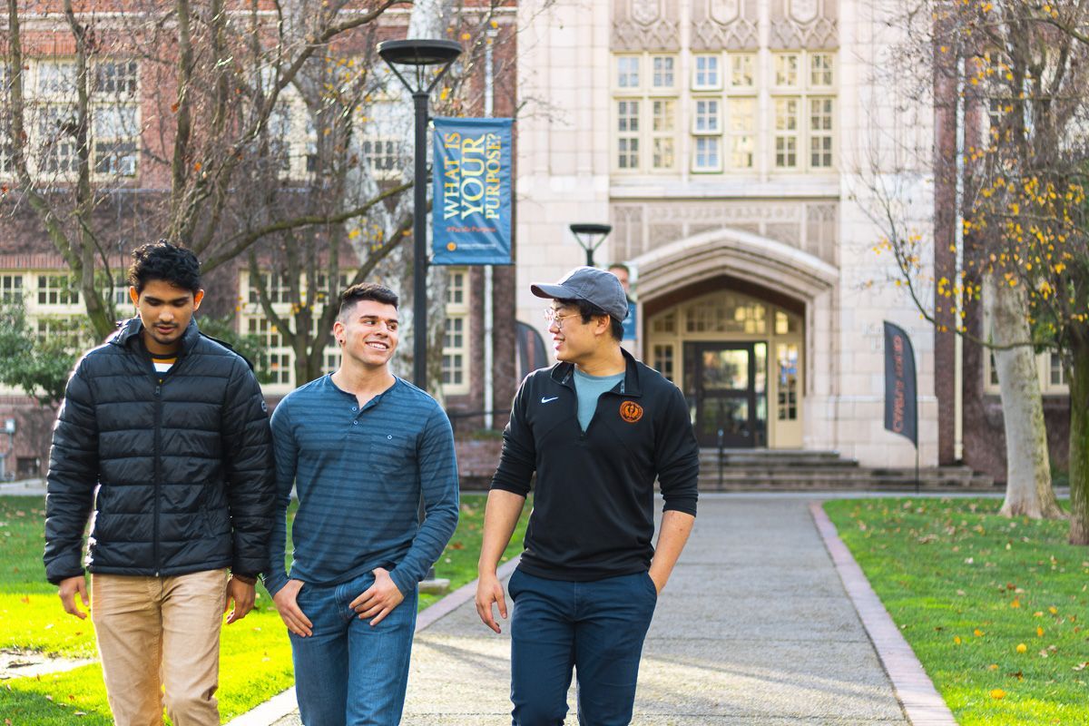 students walk in front of Knoles Hall
