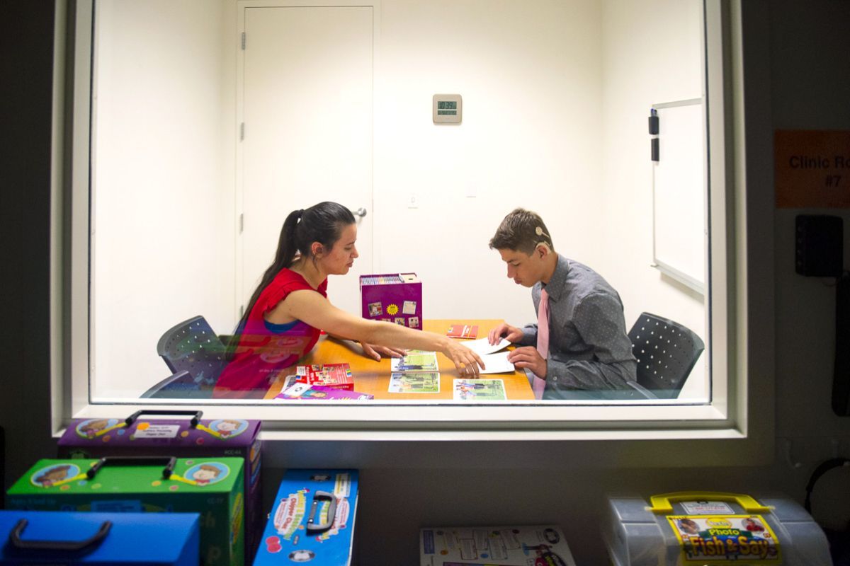 student working with a patient