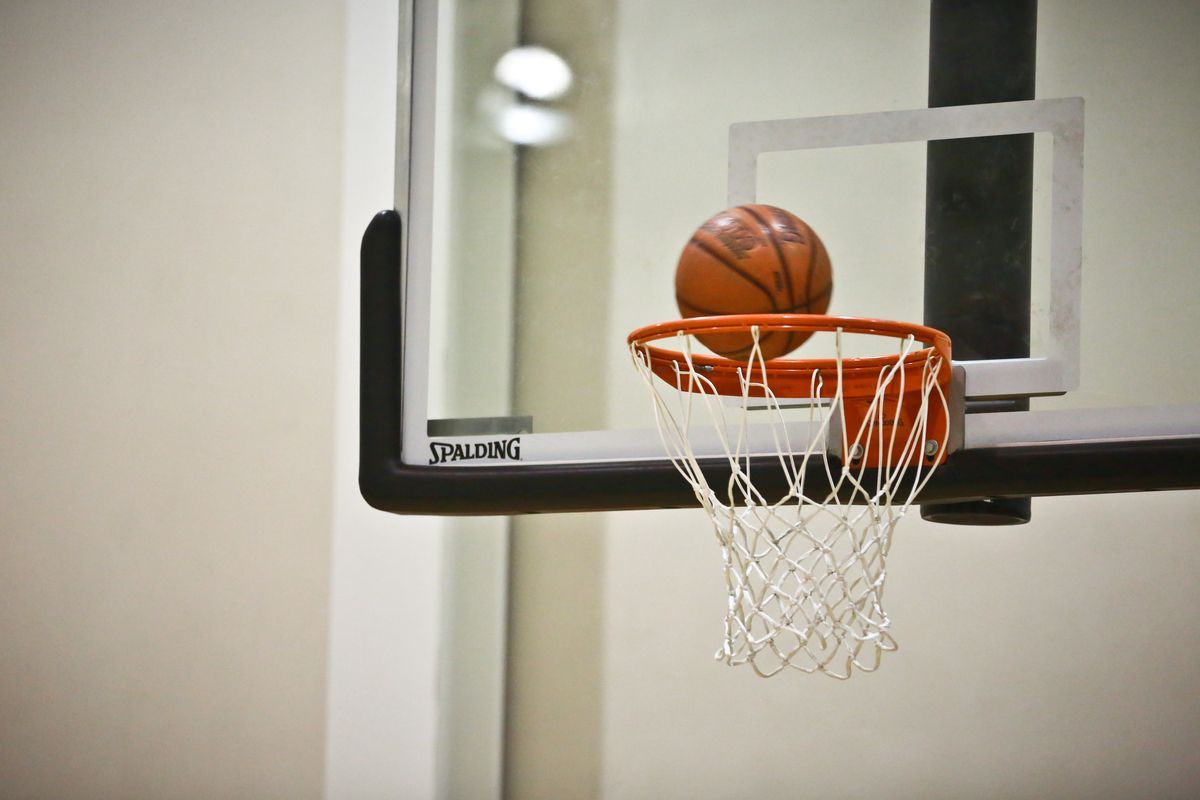 A basketball about to go in the net
