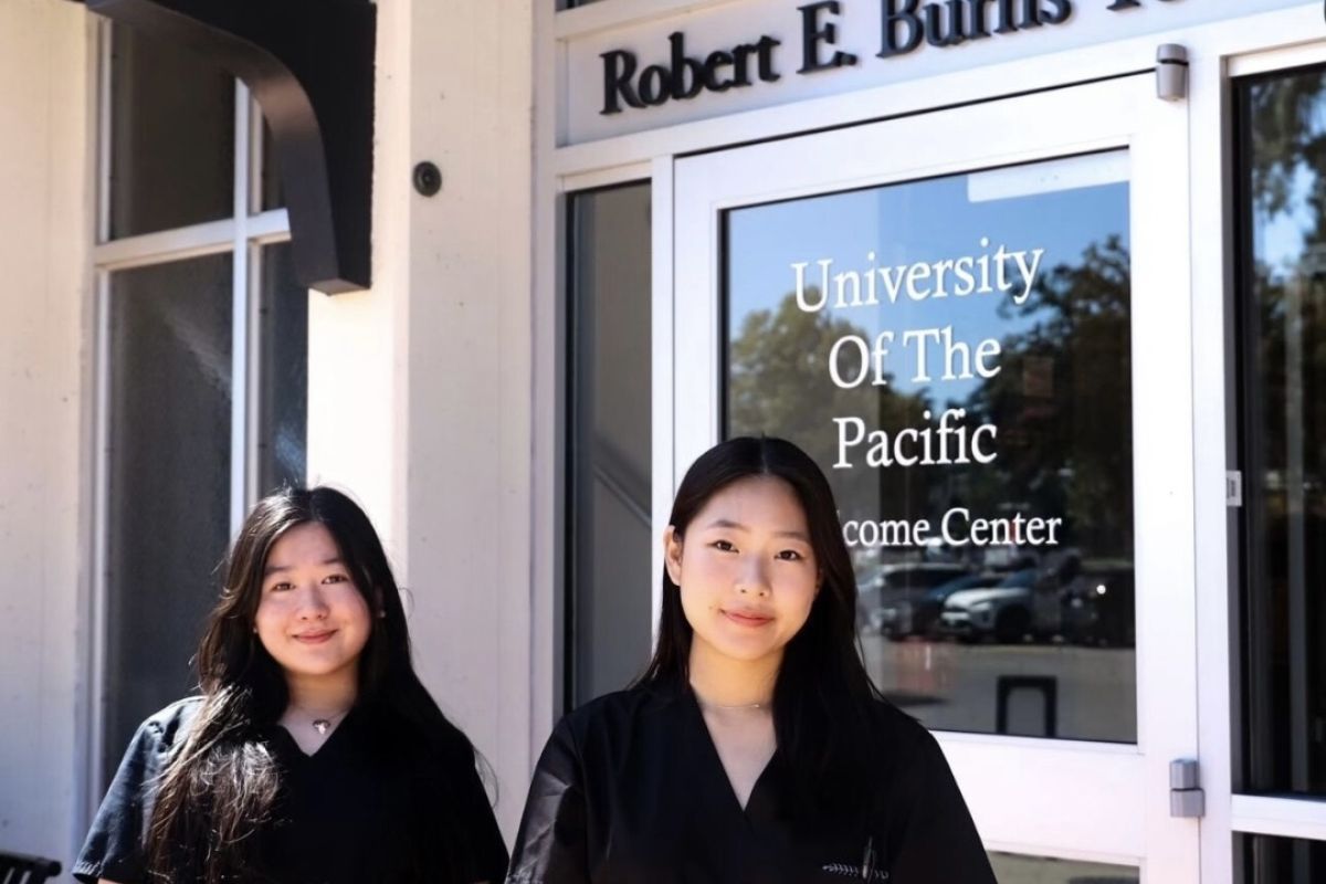 two pre-health students in front of burns tower