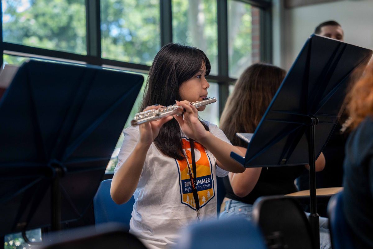 Student playing instrumental 