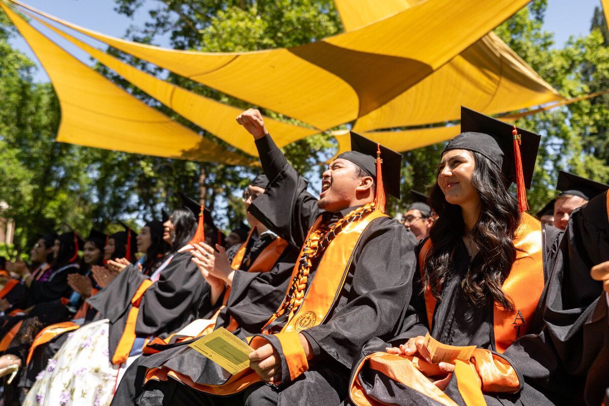 pacific graduates sit together during commencement ceremony