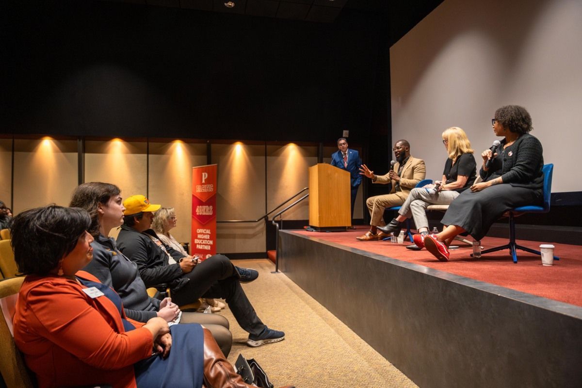 49ers staff on a stage in front of an audience of Pacific students