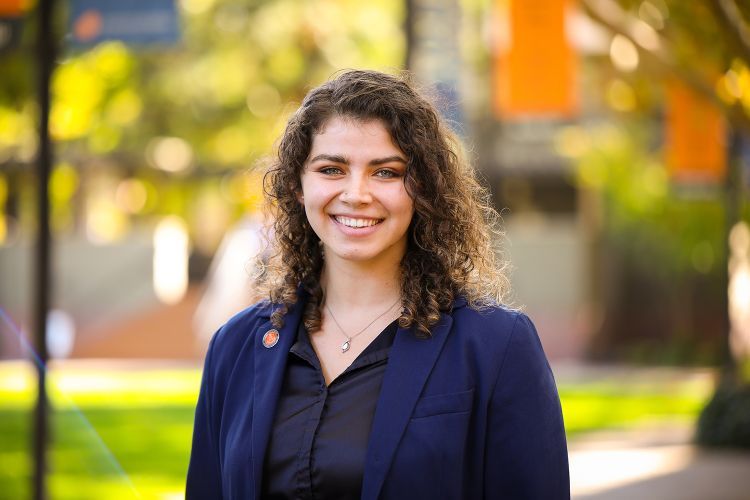 A law student poses for a photo.