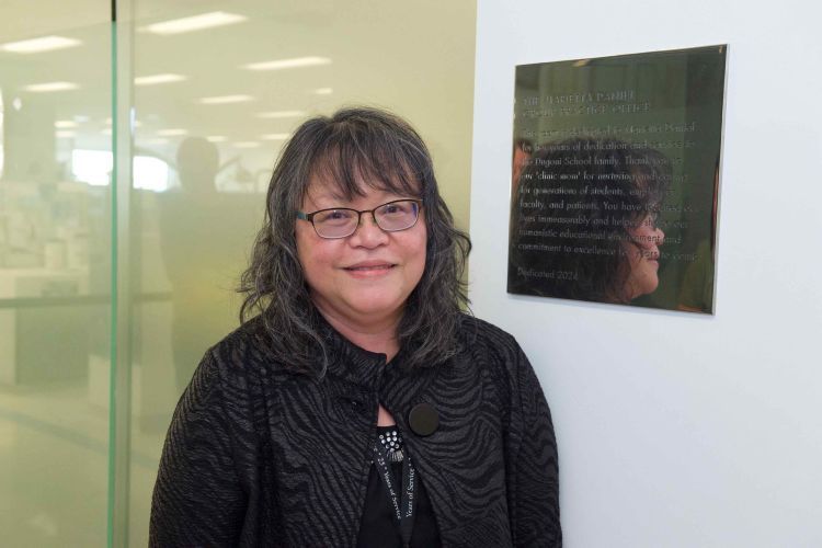 Marietta next to the plaque