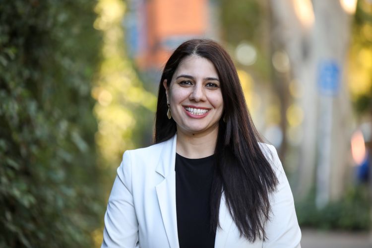 Mara Aldajani smiles for a headshot photo