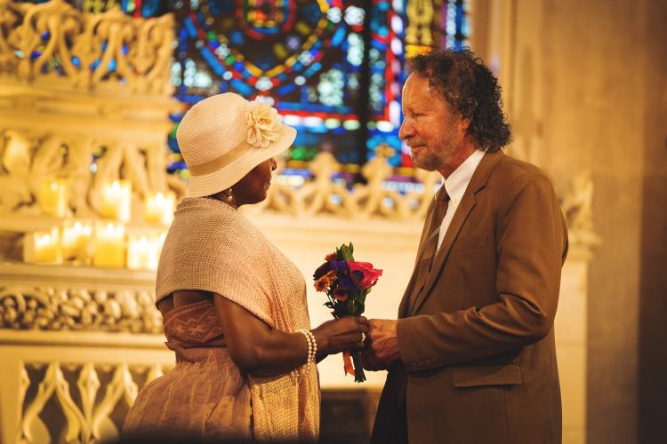couple stands at an altar in Morris Chapel