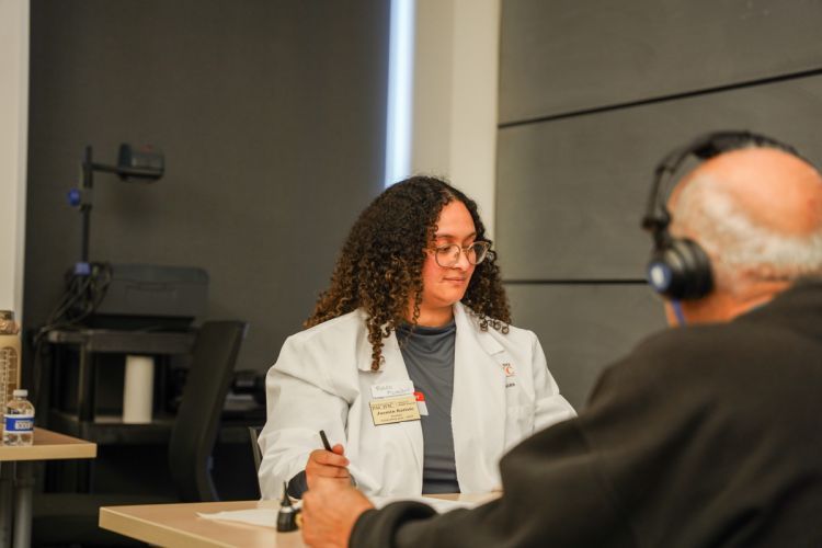 an audiology student conducts a screening