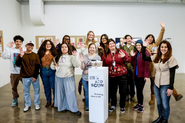 Faculty and students gather for a group photo at Reynolds Gallery.