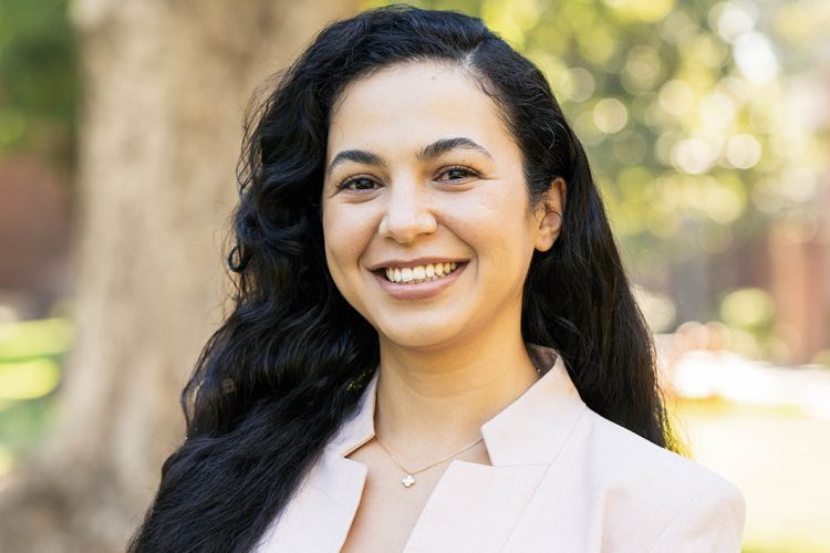 A women smiles for a professional headshot.