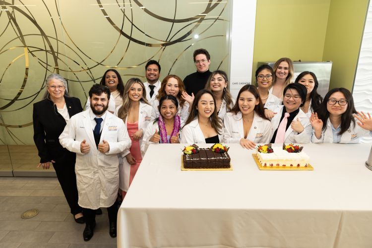group of dental hygiene students celebrating pinning