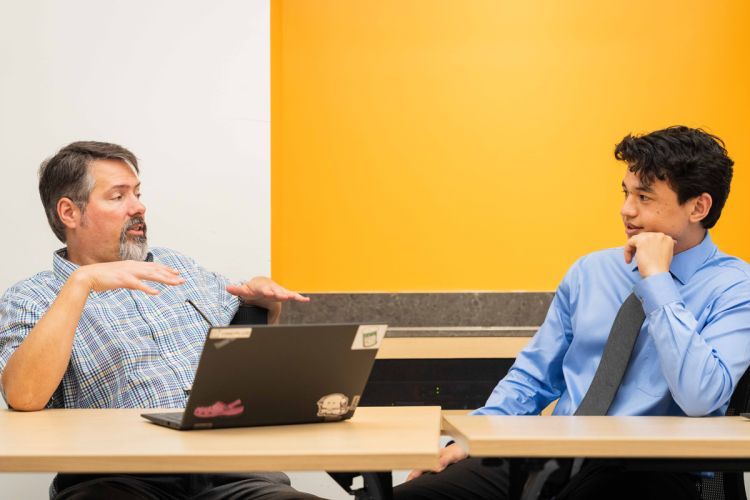 Dr. Ed Rogan with student in classroom