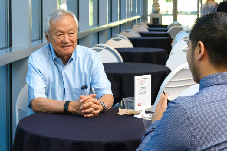 Norman Kobayashi ’70, ’73 with graduate student at scholarship recognition event 