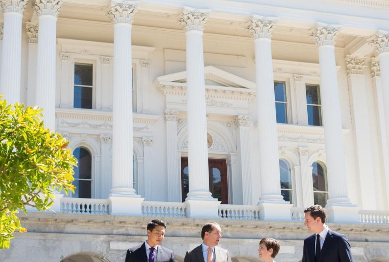 People standing in front of a building.