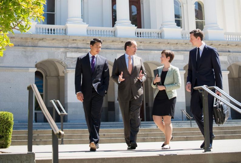 People standing in front of a building.