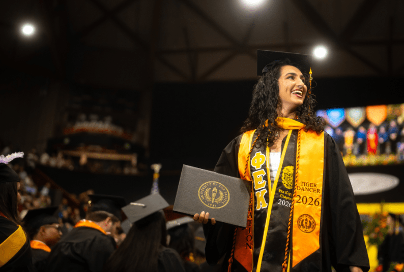 A graduate with her degree