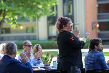 Audience applauds at Years of Service event.