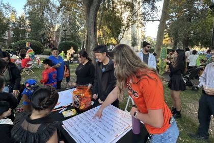 Students tabling at Pacific Trick or Treat.
