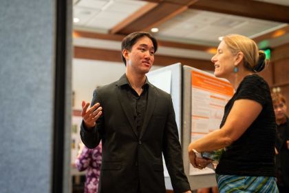 Student researcher talks to College of the Pacific dean Lee Skinner.