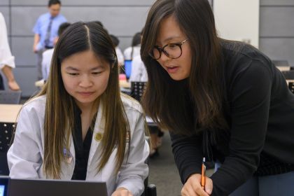 Faculty member Yvonne Mai ’13, ’15, PharmD, MS, BCGP, BCACP, FCSHP with PharmD student