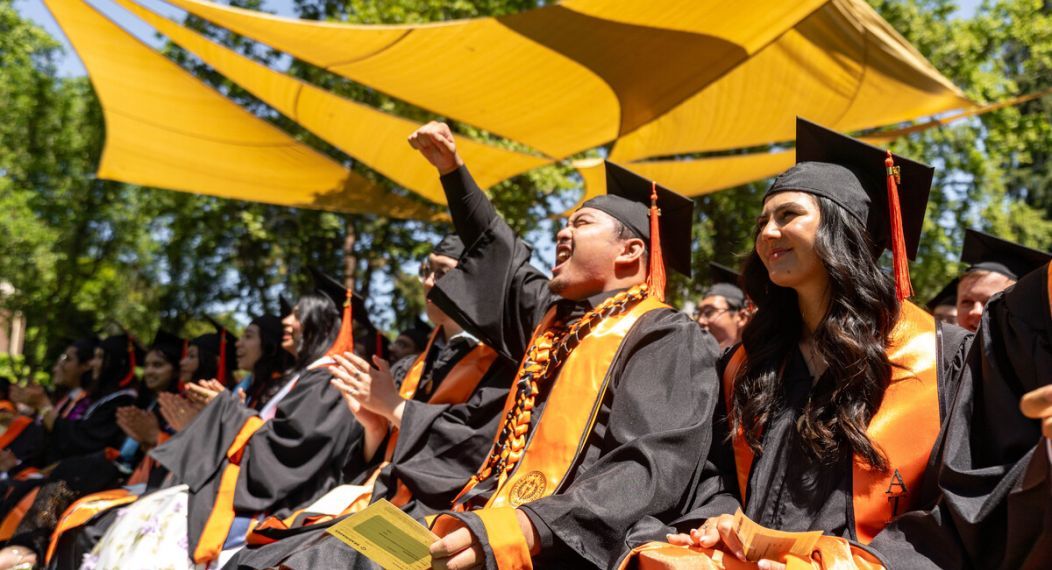 pacific graduates sit together during commencement ceremony