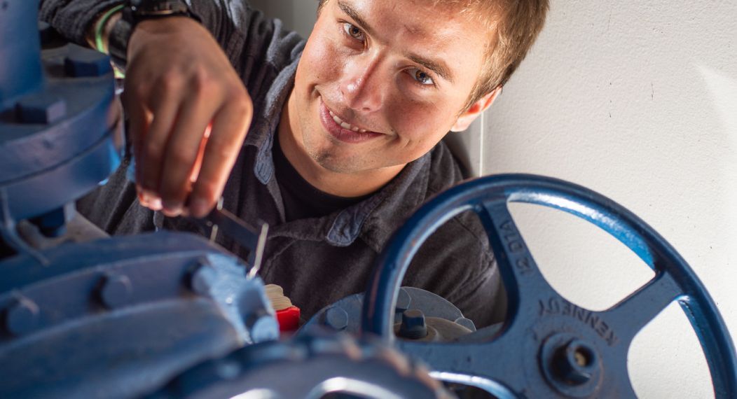Student turning wheels