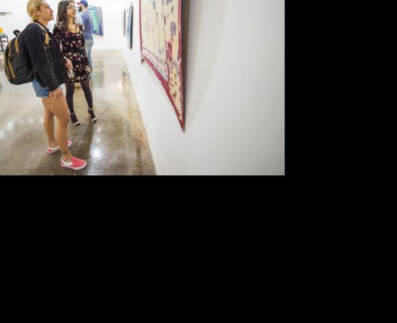 students looking at paintings