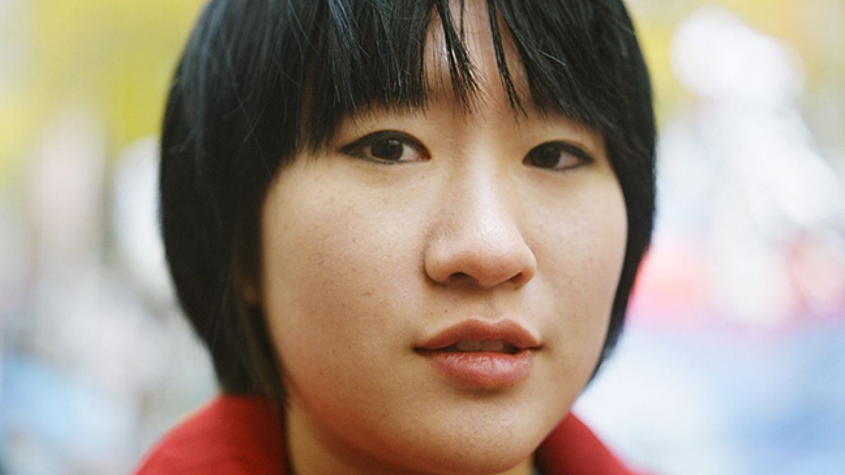 Black haired woman red coat