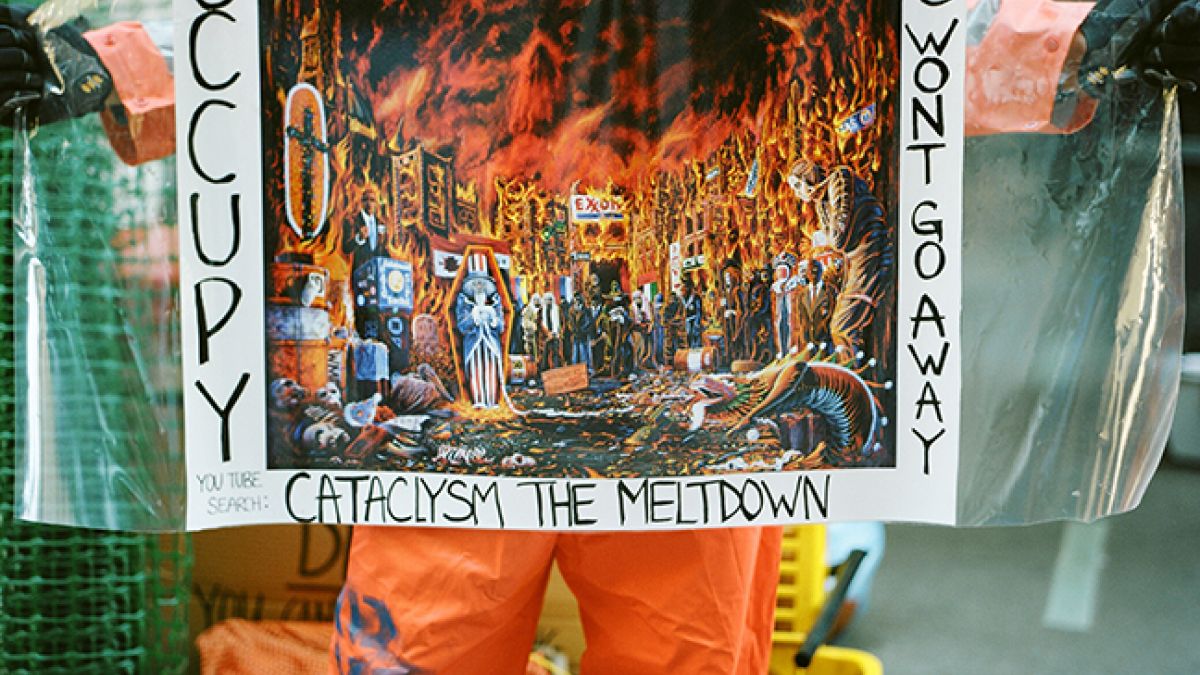 Orange jumpsuit sign on fire
