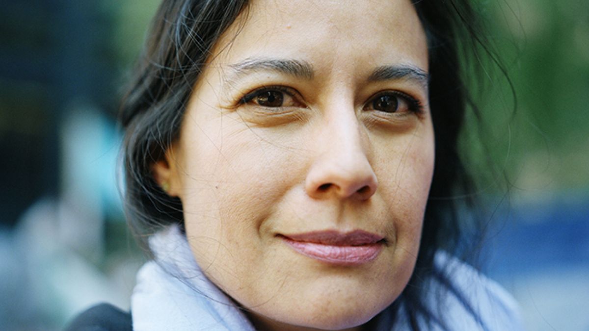 Dark haired woman with gray scarf