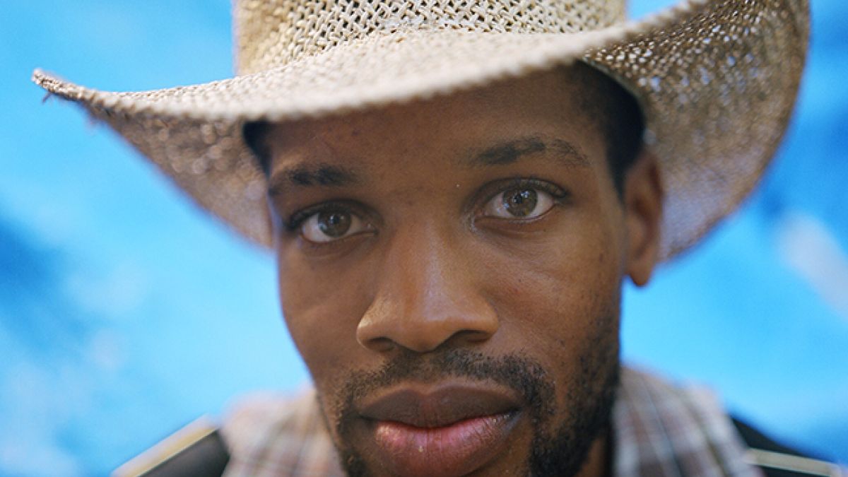 Man in straw cowboy hat
