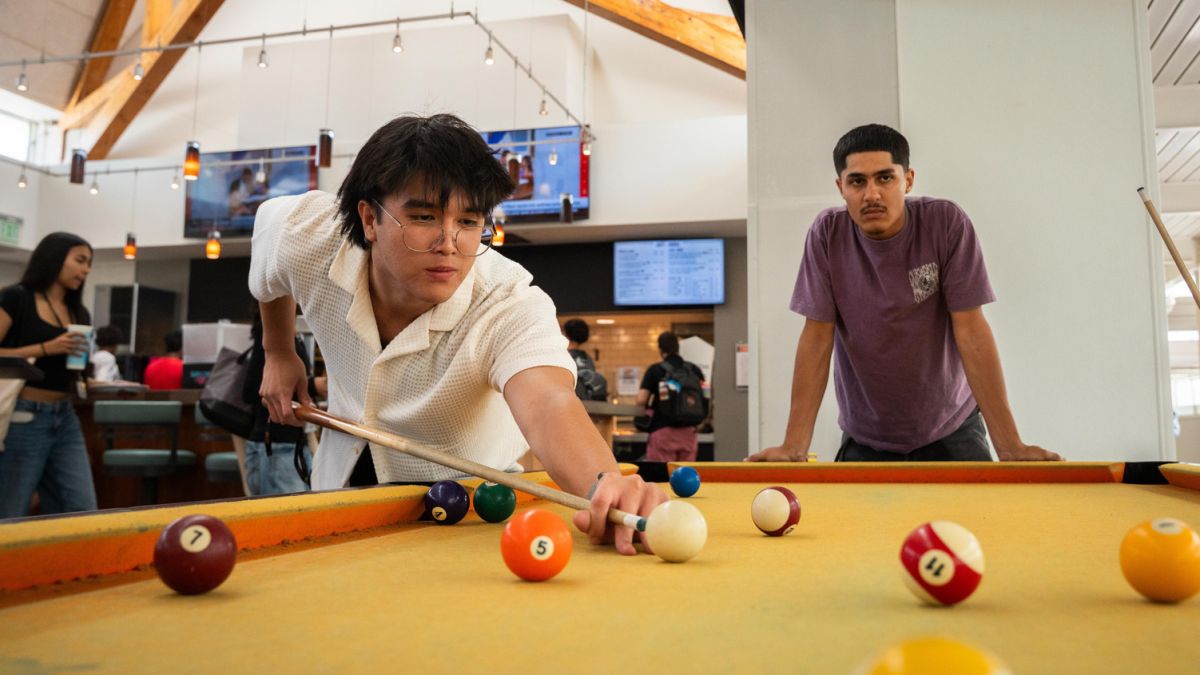 Students play pool in the Lair