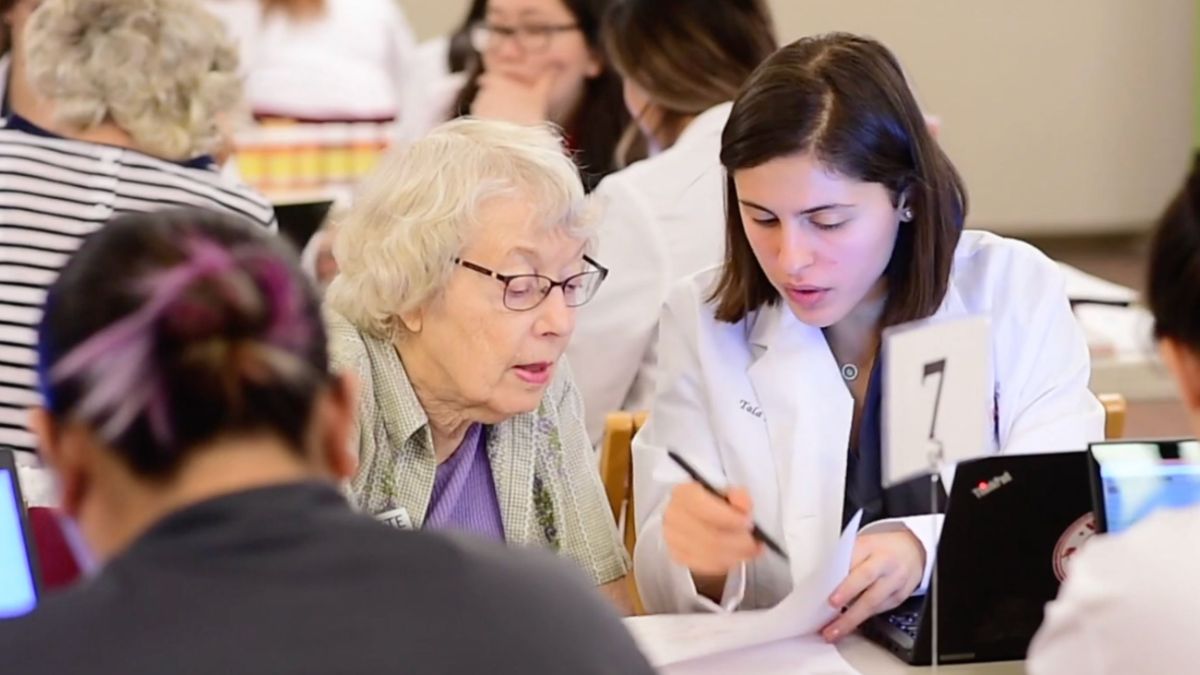 A pharmacy student helps a client navigate Medicare Part D 